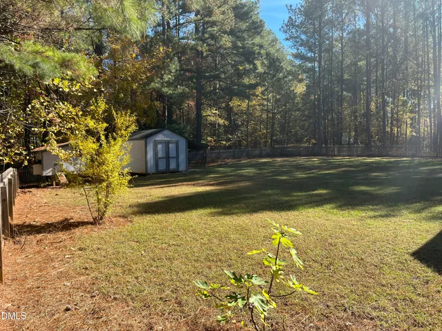 a view of a yard with an trees