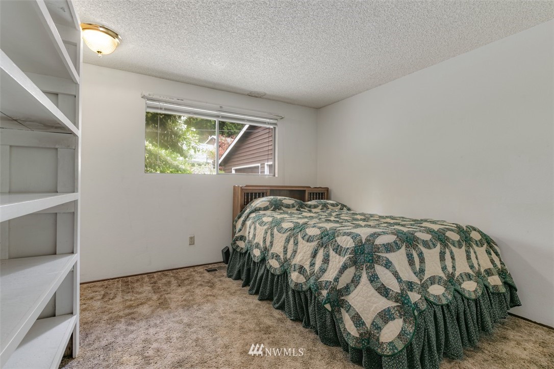 23525 27th Avenue Southeast Bothell, WA 98021 - Photo 13 of 40 a bedroom with a bed and a window