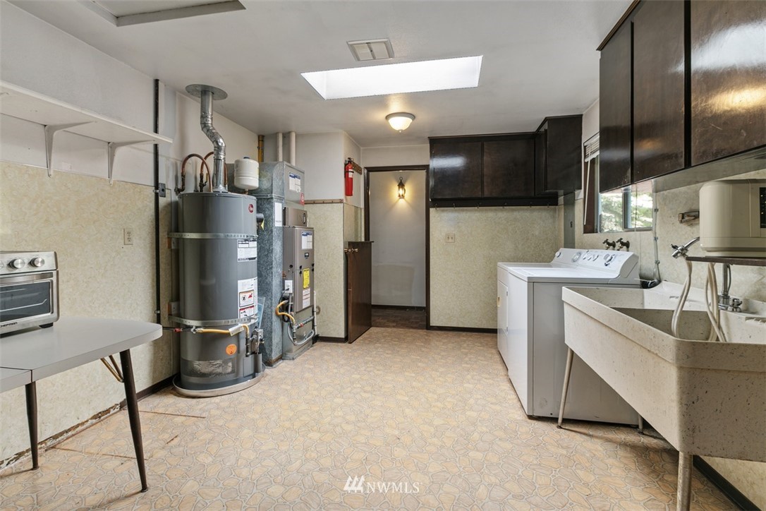 23525 27th Avenue Southeast Bothell, WA 98021 - Photo 18 of 40 a kitchen with refrigerator and chairs