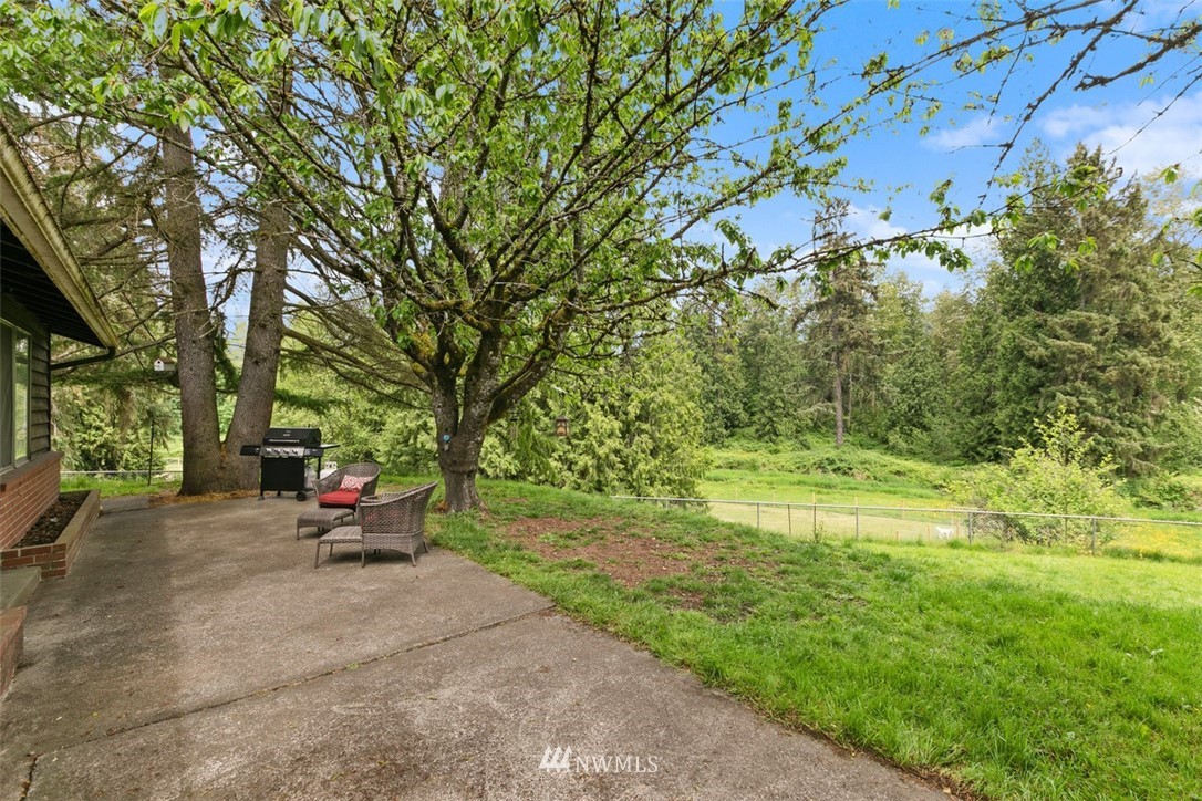 23525 27th Avenue Southeast Bothell, WA 98021 - Photo 25 of 40 a backyard of a house with a yard and outdoor seating