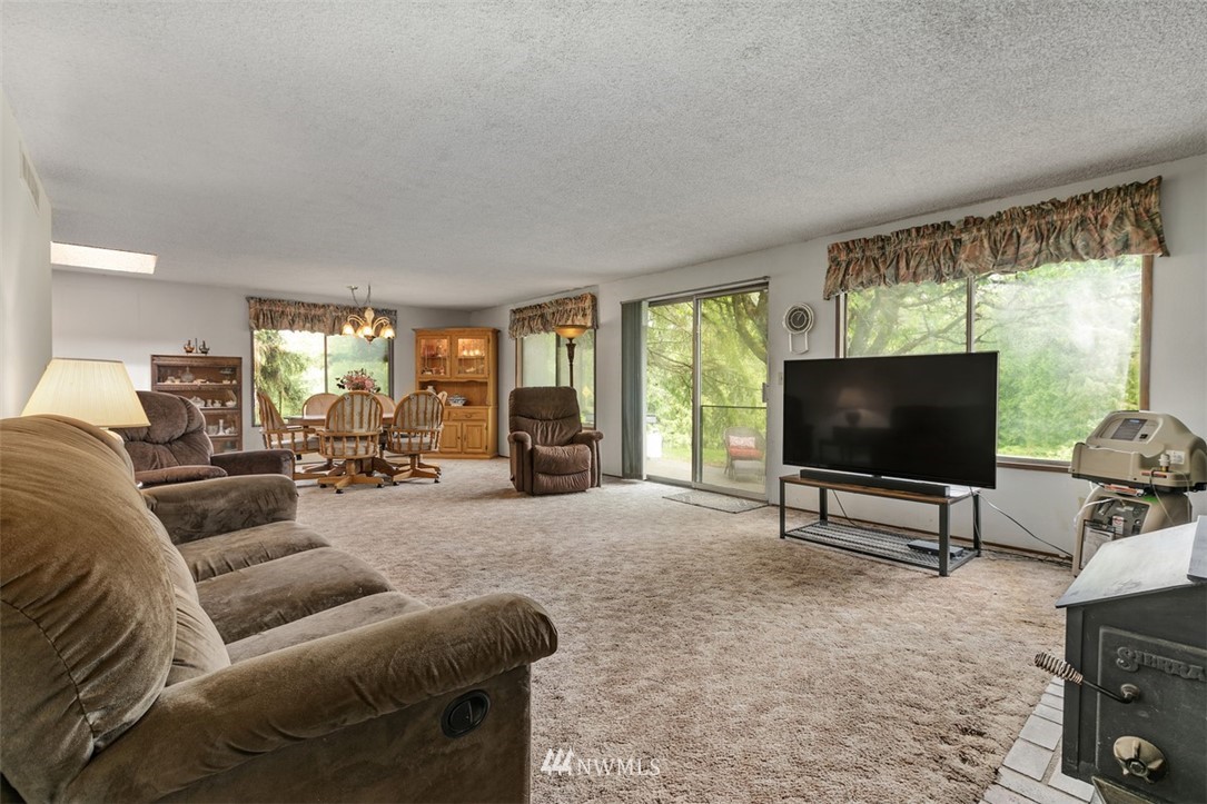 23525 27th Avenue Southeast Bothell, WA 98021 - Photo 4 of 40 a living room with furniture and a flat screen tv