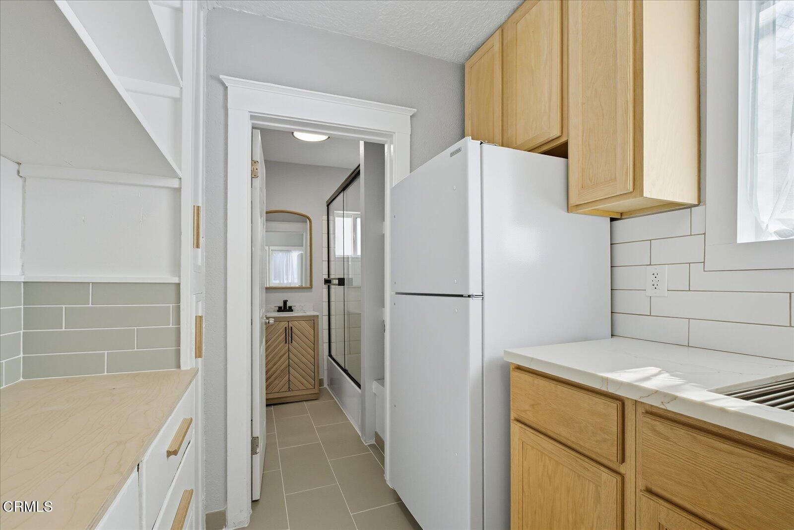 1488 Sunset Boulevard, Unit 1/4 Los Angeles, CA 90026 - Photo 14 of 30 a bathroom with a bathtub and a sink