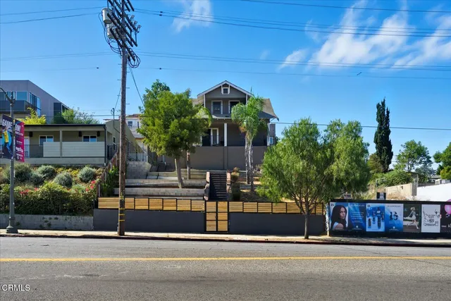 a view of a house with a street