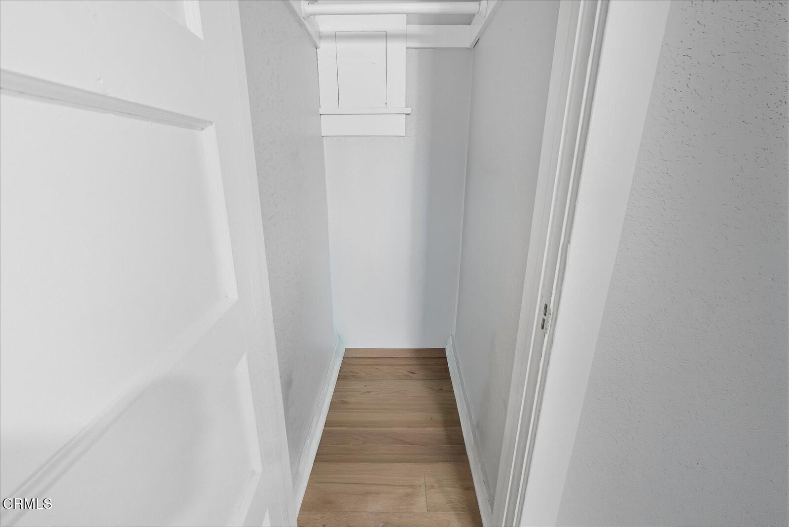 1488 Sunset Boulevard, Unit 1/4 Los Angeles, CA 90026 - Photo 22 of 30 a view of a hallway with wooden floor