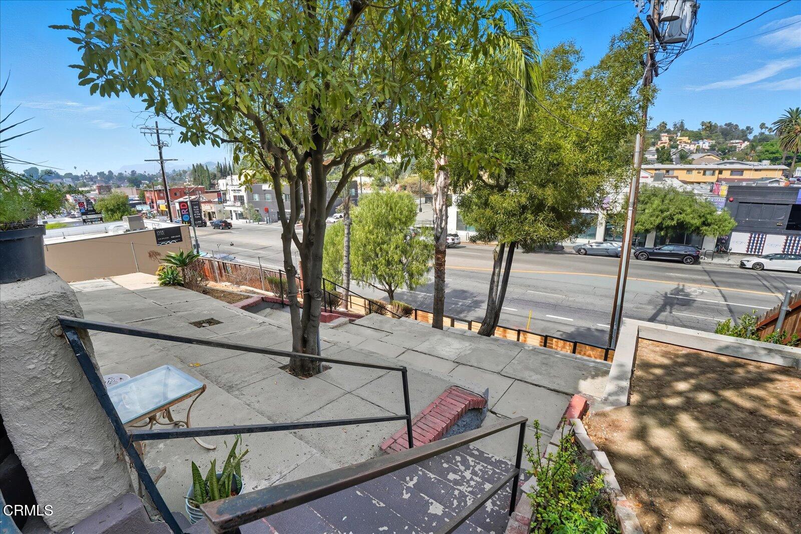 1488 Sunset Boulevard, Unit 1/4 Los Angeles, CA 90026 - Photo 23 of 30 a view of a patio with a table and chairs