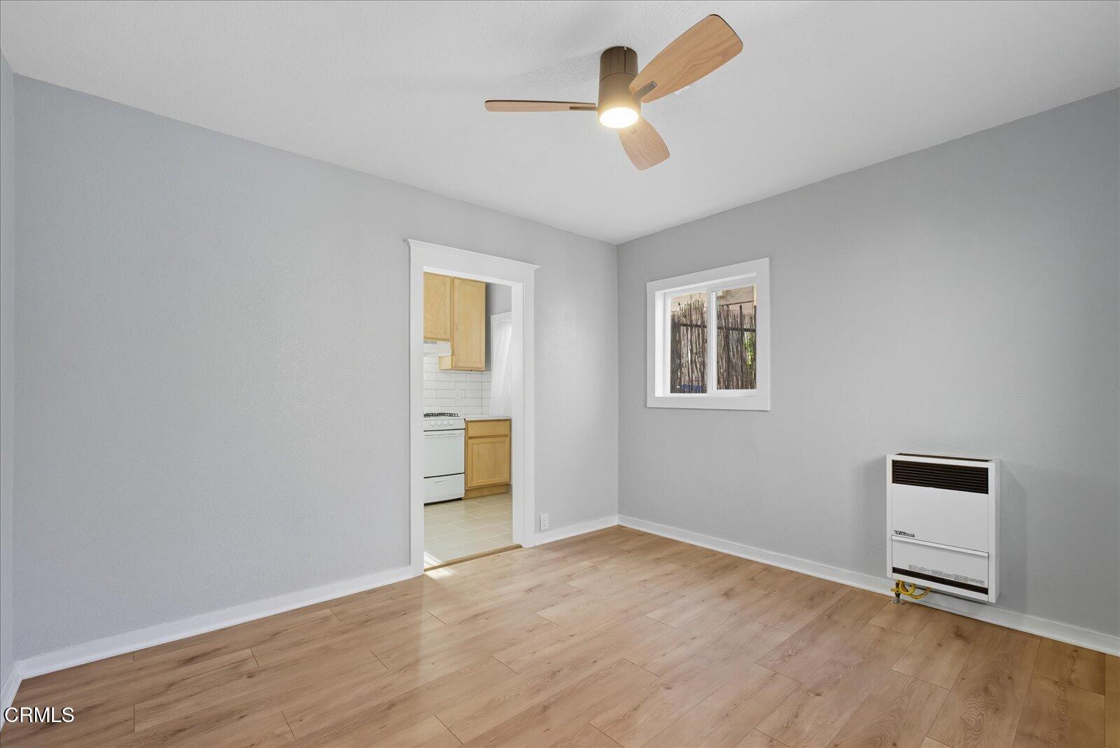 1488 Sunset Boulevard, Unit 1/4 Los Angeles, CA 90026 - Photo 7 of 30 a view of empty room with wooden floor