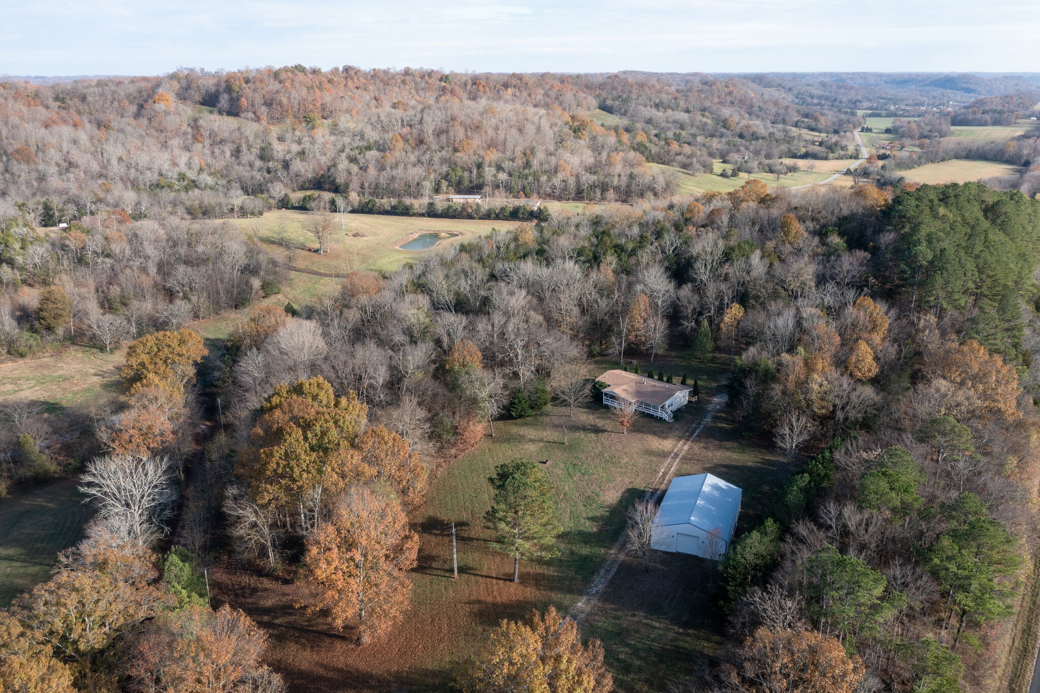 6725 Beech Hill Road Pulaski, TN 38478 - Photo 8 of 39 an aerial view of house with yard and mountain view in back