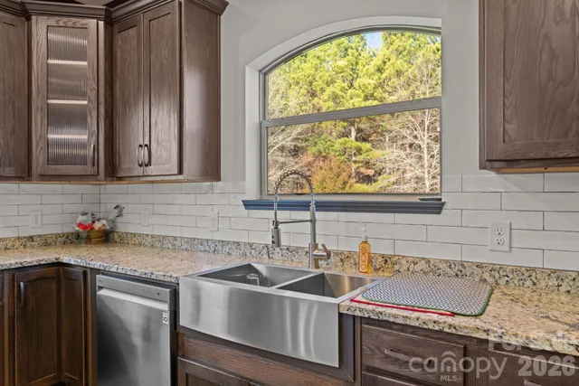a kitchen with a sink and a refrigerator