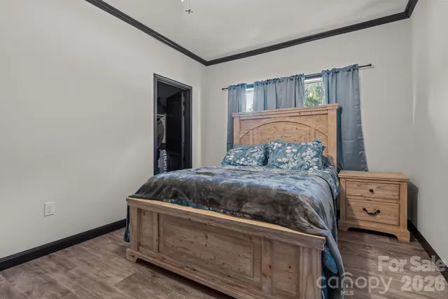 a bedroom with a bed and a mirror