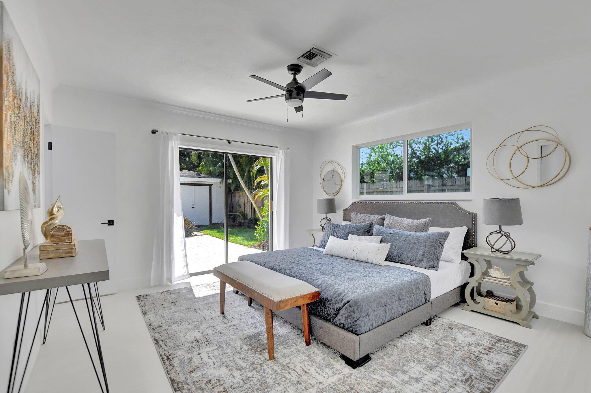 832 Southwest 10th Avenue Boca Raton, FL 33486 - Photo 20 of 57 a bed room with a bed and a window