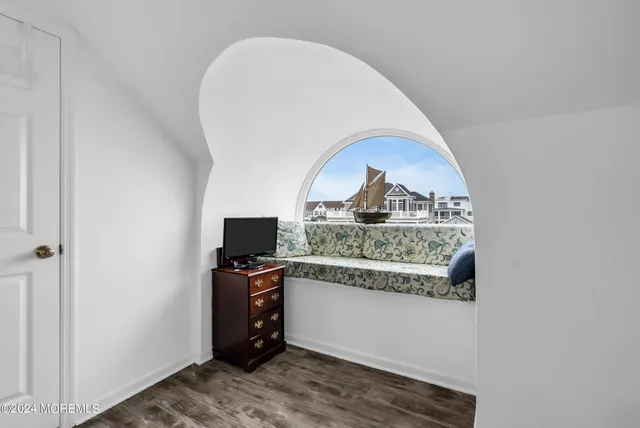 a view of a kitchen cabinets and a wooden floor