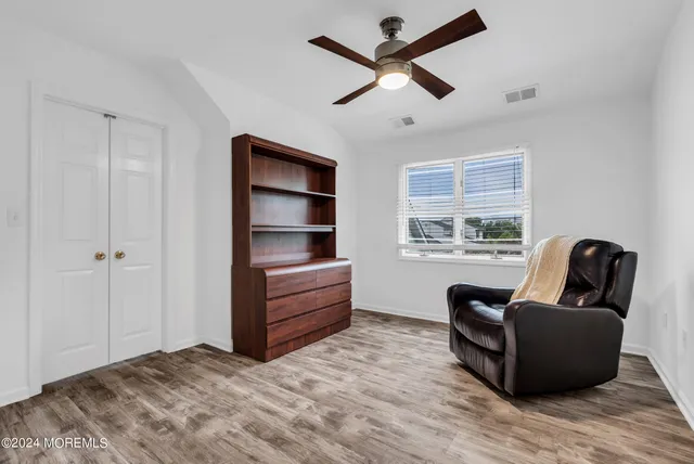 a bedroom with furniture and window
