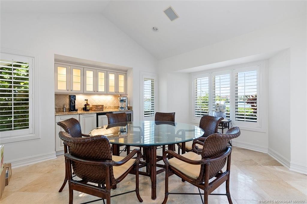 2421 Bahia Way Stuart, FL 34996 - Photo 14 of 83 a view of a dining room with furniture window and outside view
