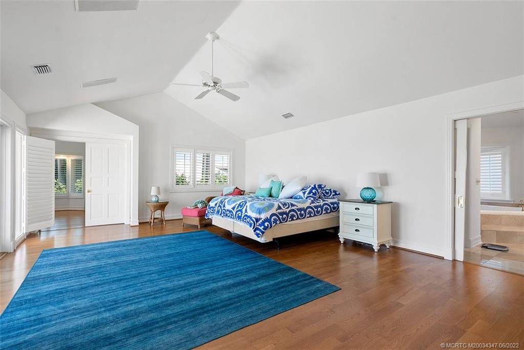 2421 Bahia Way Stuart, FL 34996 - Photo 16 of 83 a living room with furniture and wooden floor