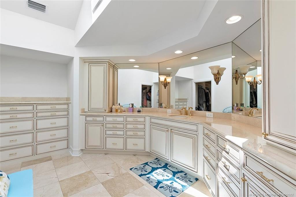 2421 Bahia Way Stuart, FL 34996 - Photo 19 of 83 a large white kitchen with a sink and cabinets