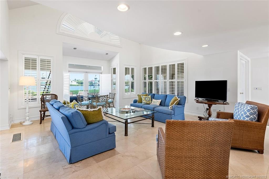 2421 Bahia Way Stuart, FL 34996 - Photo 7 of 83 a living room with furniture and a flat screen tv