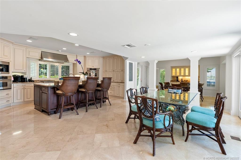 2421 Bahia Way Stuart, FL 34996 - Photo 10 of 83 a view of a dining area with furniture
