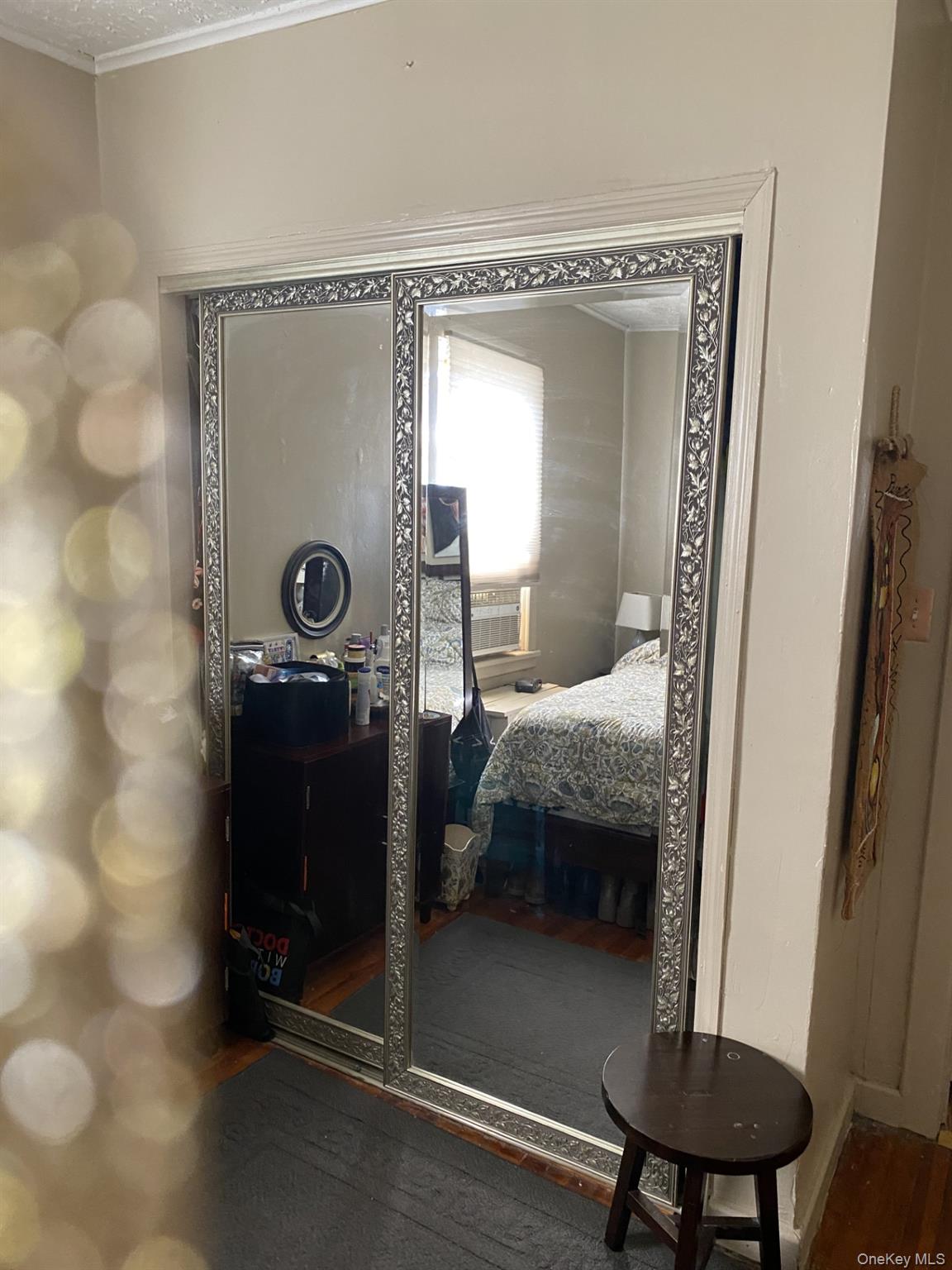 145-24 223rd Street Queens, NY 11413 - Photo 5 of 16 a bathroom with a toilet a sink and mirror