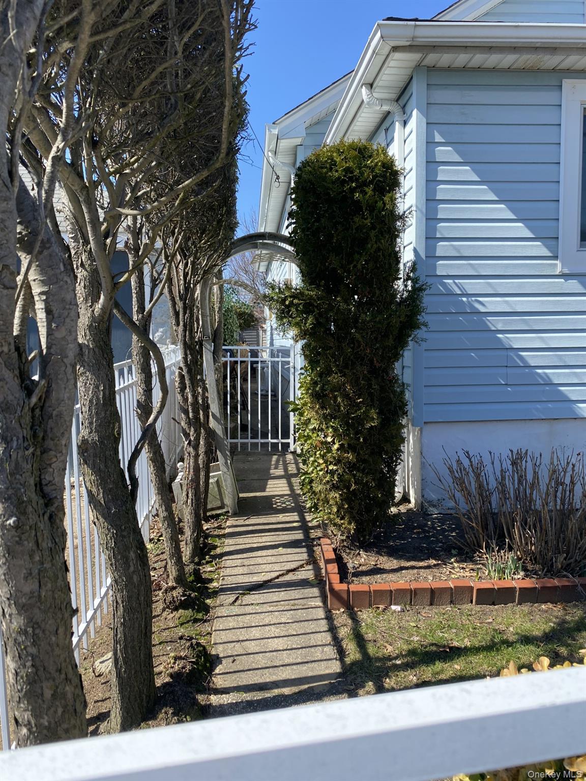 145-24 223rd Street Queens, NY 11413 - Photo 8 of 16 a view of a house with a yard