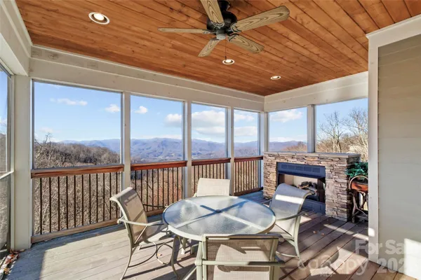 a dining room with furniture window and wooden floor