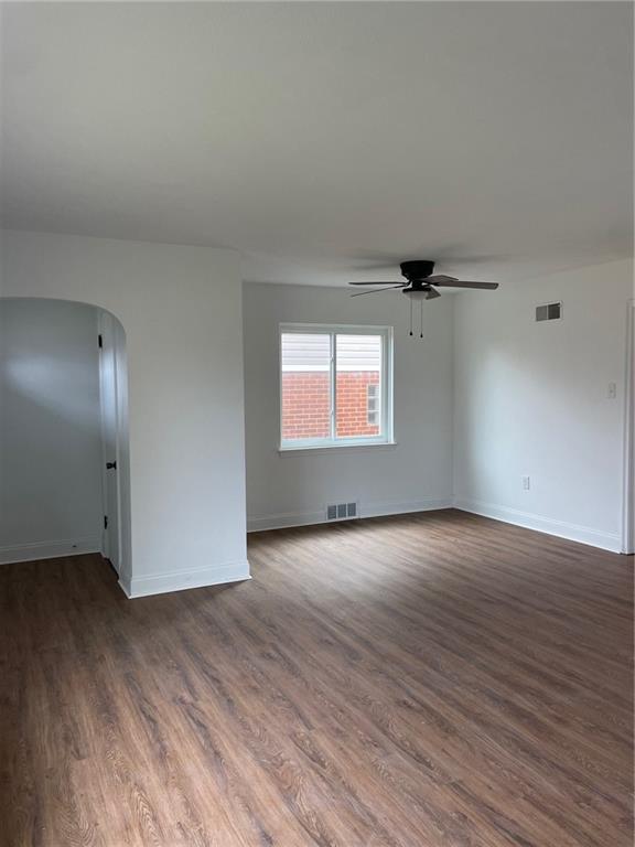106 Larry Street Aliquippa, PA 15001 - Photo 2 of 14 an empty room with wooden floor and windows