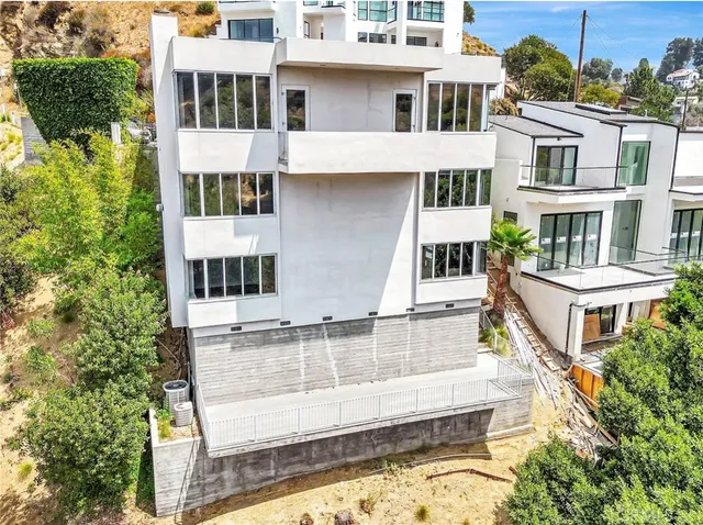 a view of a large building with a swimming pool