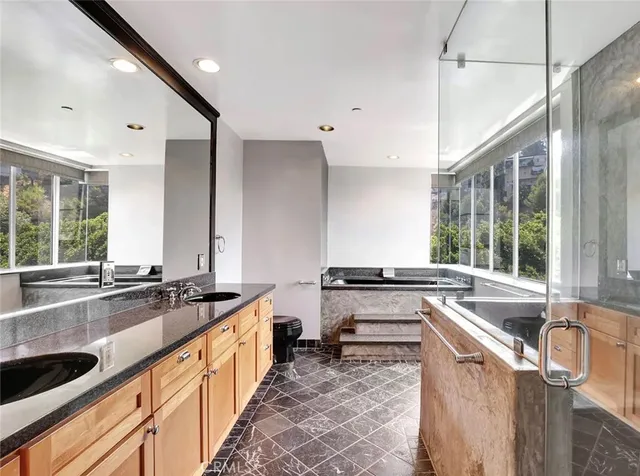 a kitchen with sink stove and cabinets