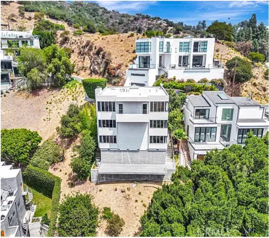 an aerial view of a house with a garden