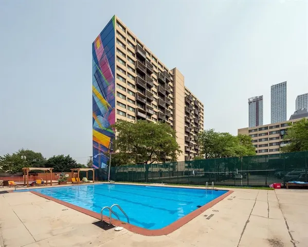 a view of swimming pool with chairs