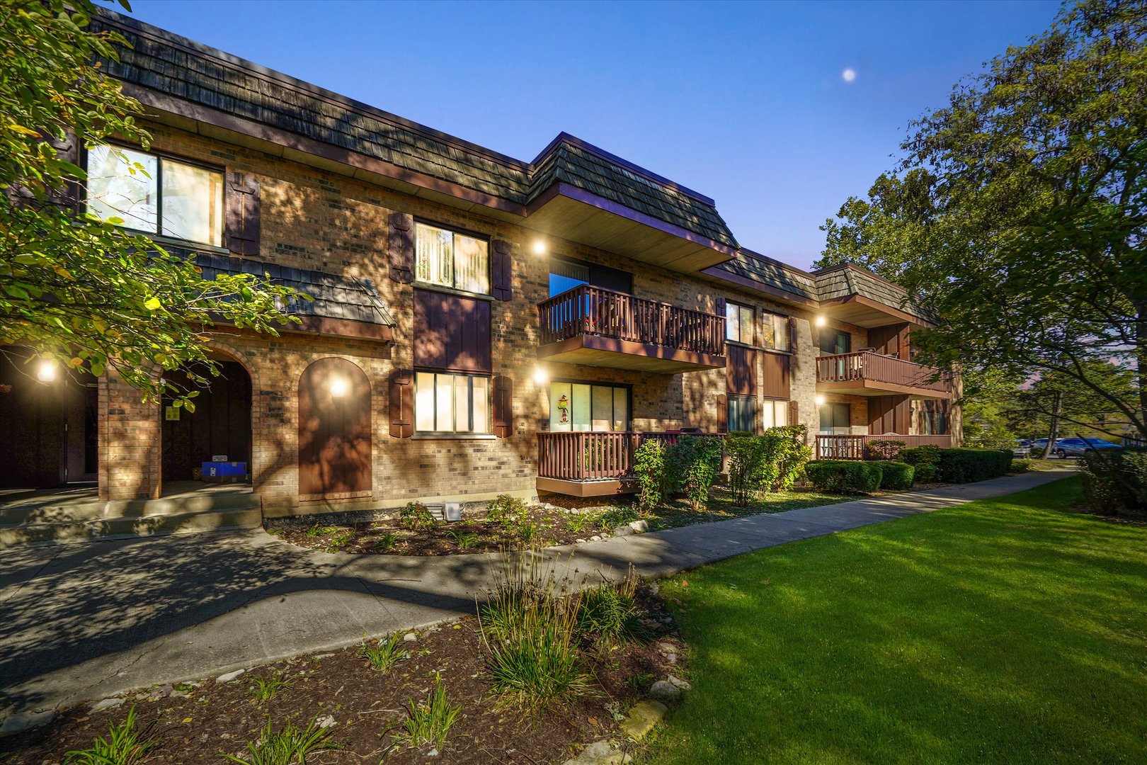 7920 Woodglen Lane, Unit 207 Downers Grove, IL 60516 - Photo 1 of 2 a view of a building with a swimming pool