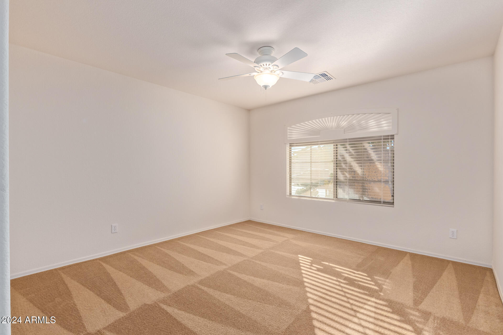 2101 South Meridian Road, Unit 172 Apache Junction, AZ 85120 - Photo 11 of 43 a view of an empty room with a window