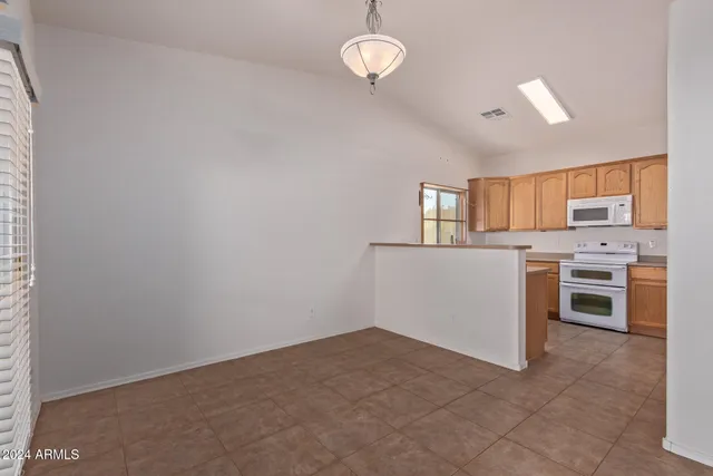 a view of a kitchen with a sink cabinets and window