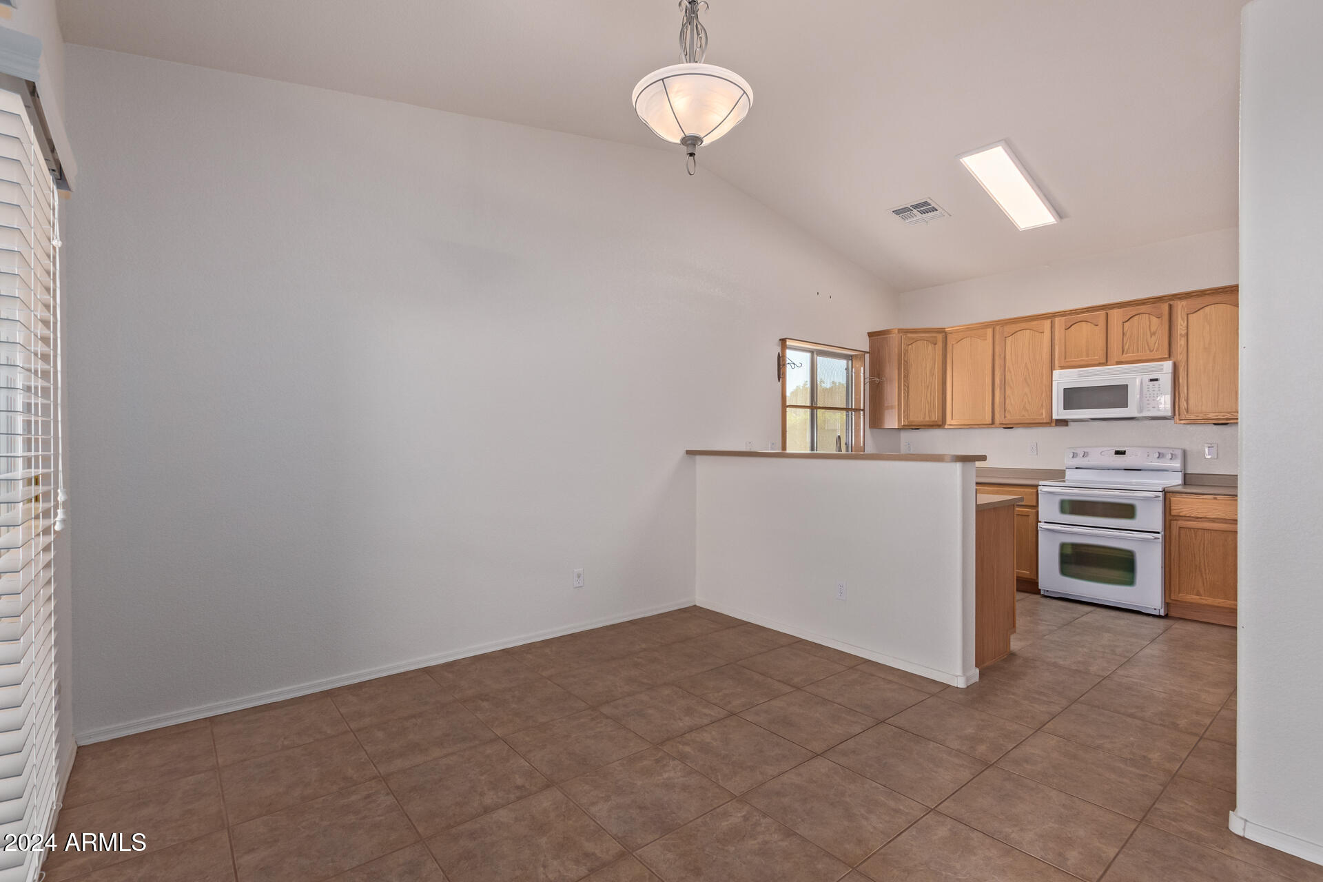 2101 South Meridian Road, Unit 172 Apache Junction, AZ 85120 - Photo 20 of 43 a view of a kitchen with a sink cabinets and window