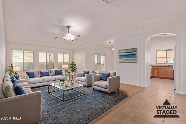 a living room with furniture and a large window