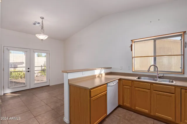 a kitchen that has a sink and window