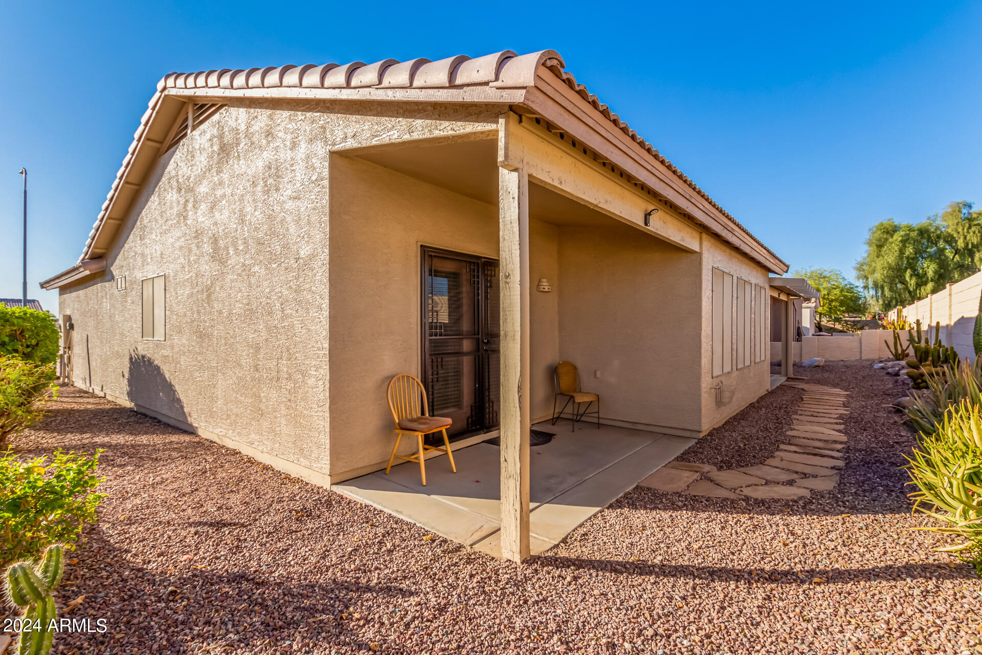 2101 South Meridian Road, Unit 172 Apache Junction, AZ 85120 - Photo 36 of 43 a view of a house with backyard