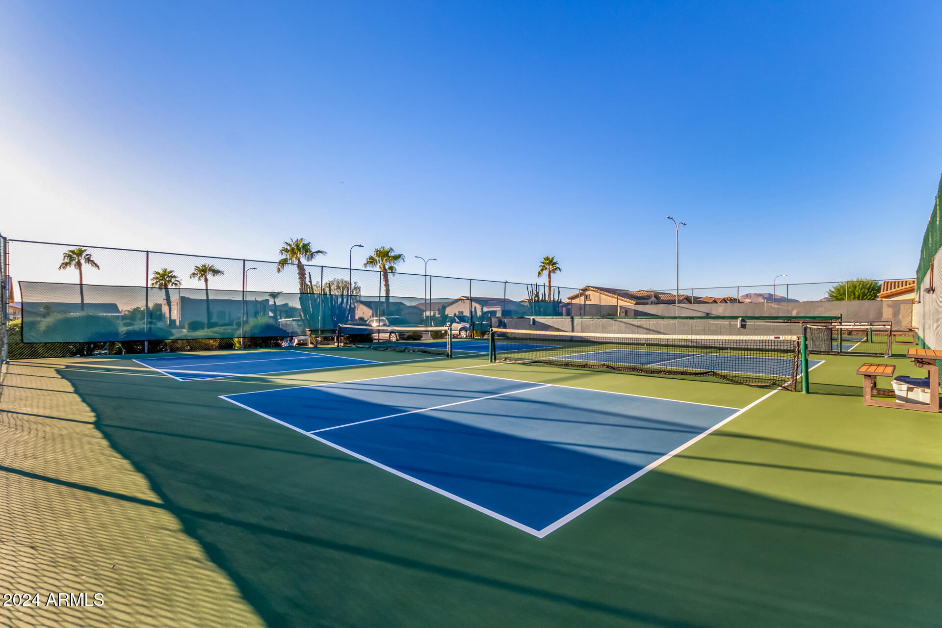 2101 South Meridian Road, Unit 172 Apache Junction, AZ 85120 - Photo 42 of 43 a view of a tennis ground with large trees