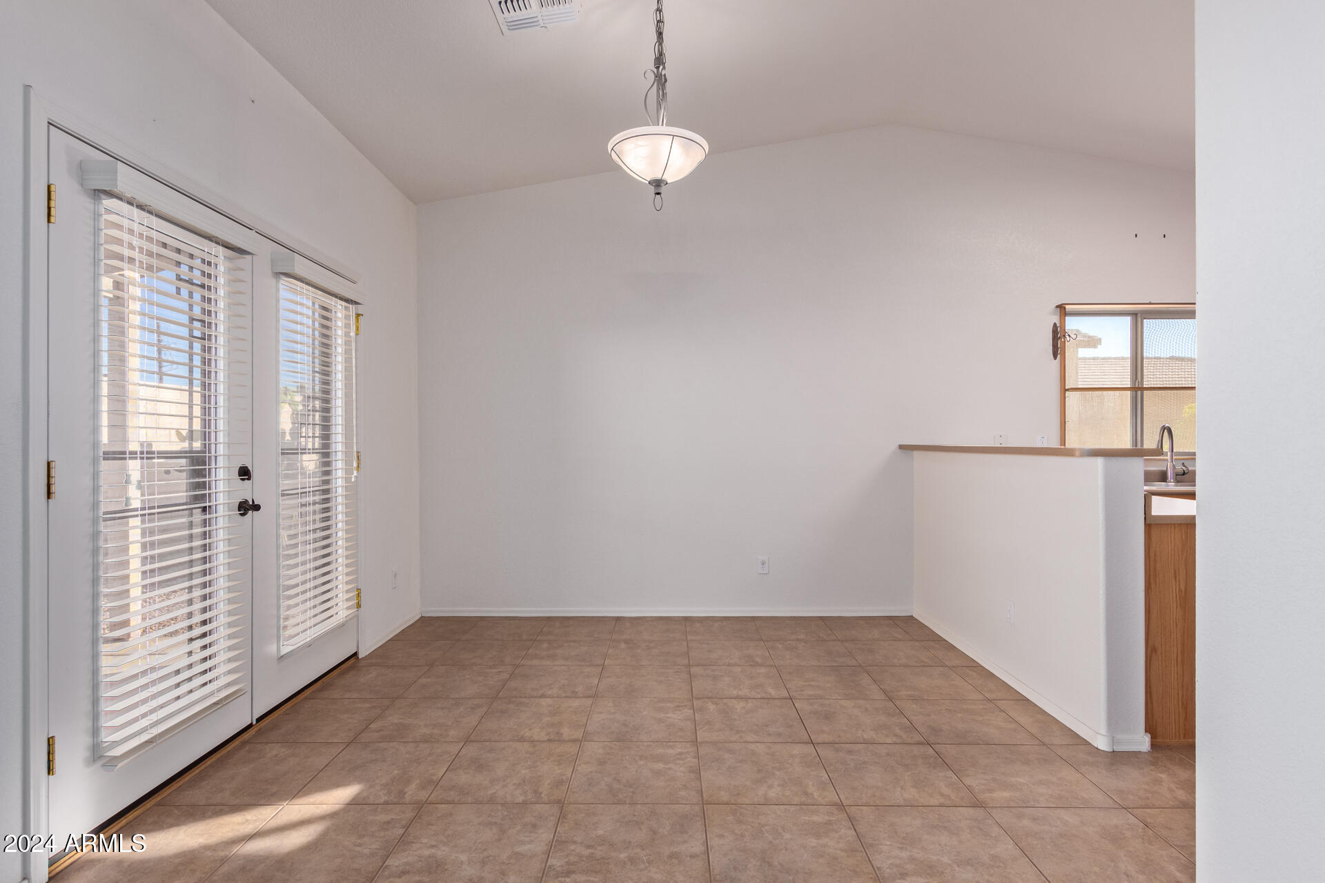 2101 South Meridian Road, Unit 172 Apache Junction, AZ 85120 - Photo 5 of 43 a view of a room with wooden floor and white walls