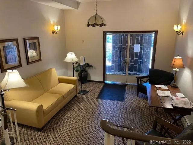 a living room with furniture and a window