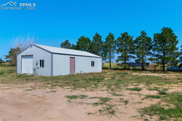 22750 Handle Road Calhan, CO 80808 - Photo 31 of 34 View of barn and solar panels.