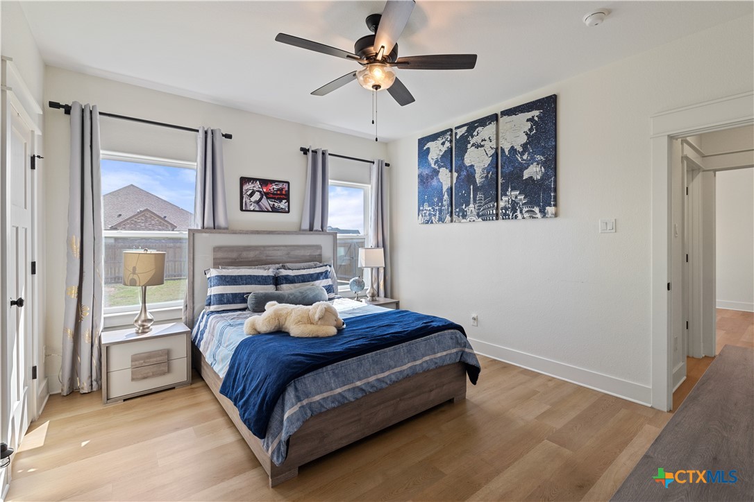 942 Inka Road Salado, TX 76571 - Photo 31 of 46 a bedroom with a bed and a painting on the wall