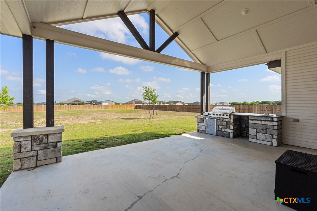 942 Inka Road Salado, TX 76571 - Photo 38 of 46 a view of a terrace with a floor to ceiling window and an outdoor view