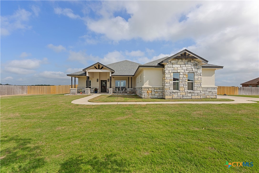 942 Inka Road Salado, TX 76571 - Photo 46 of 46 a front view of a house with a garden and yard