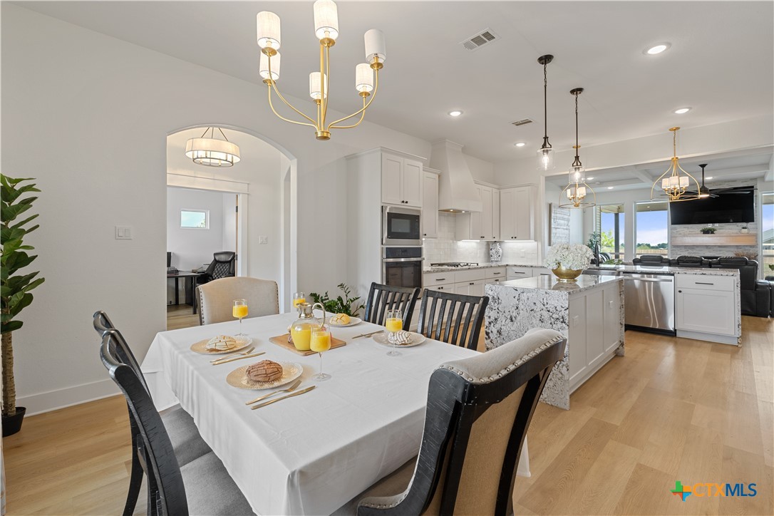 942 Inka Road Salado, TX 76571 - Photo 10 of 46 a view of a dining room and livingroom with furniture