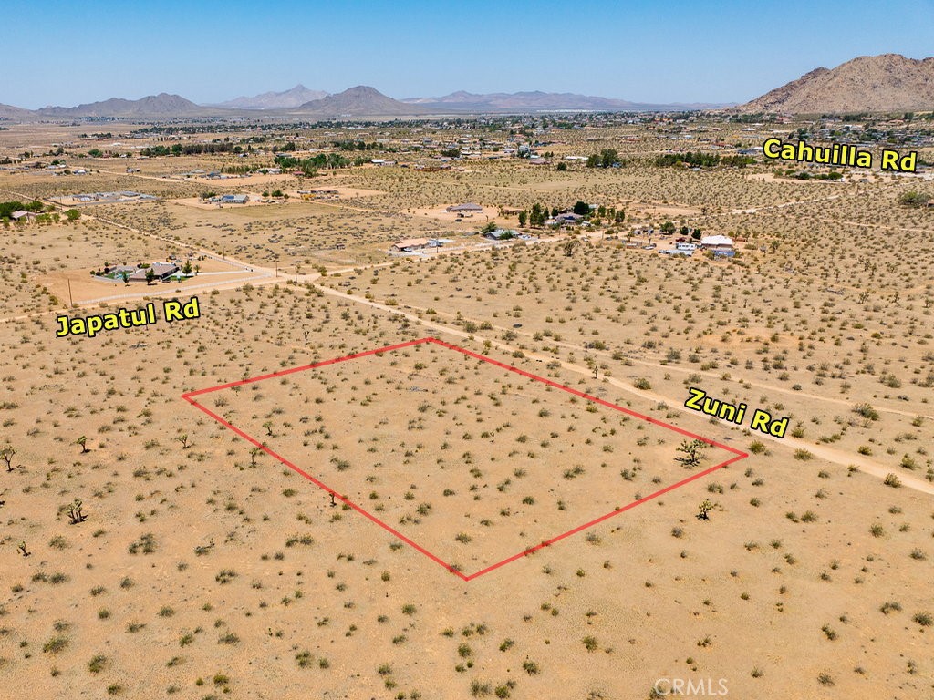 24211 Zuni Road Apple Valley, CA 92307 - Photo 1 of 1 a view of an ocean and a mountain