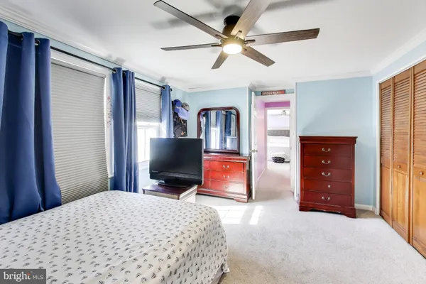 a car parked in front of road with a barbeque grill