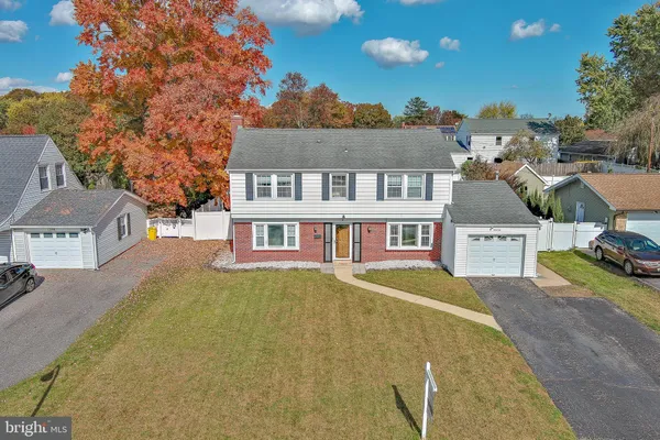 a aerial view of a house with swimming pool and sitting area
