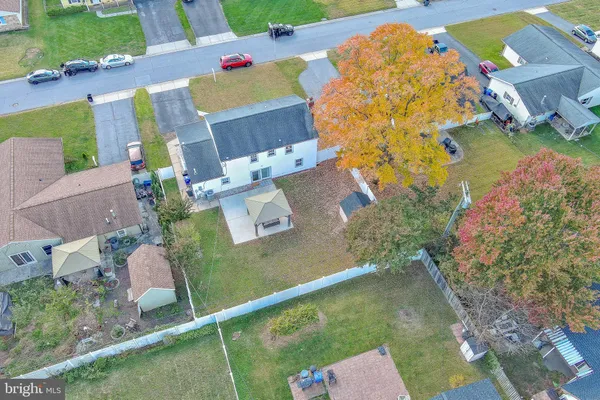 an aerial view of a house with a garden
