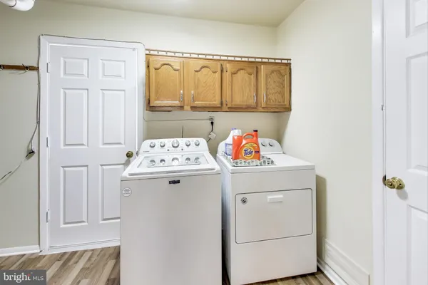 a utility room with a window dryer and washer