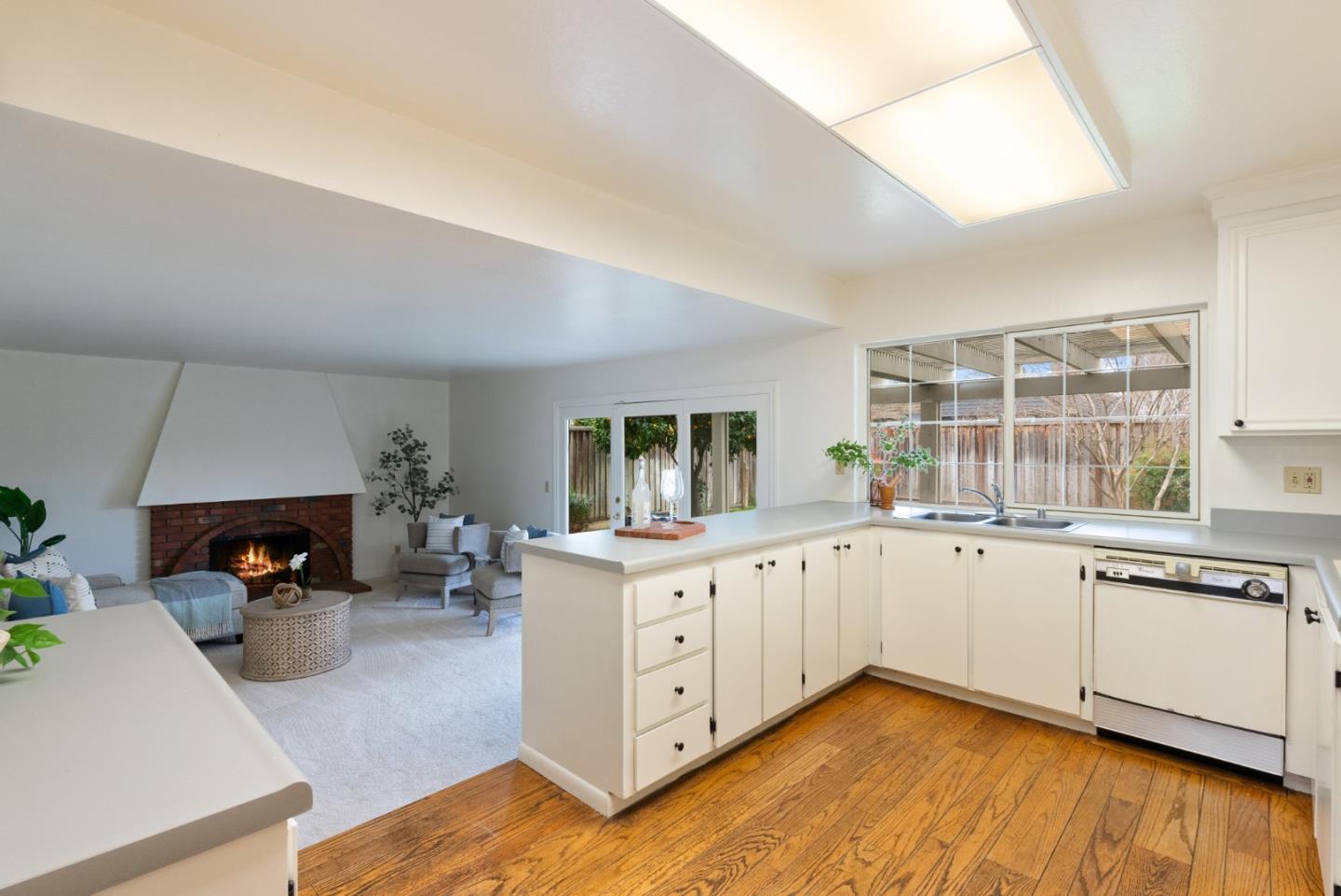 4537 Heppner Lane San Jose, CA 95136 - Photo 10 of 41 a kitchen with sink cabinets and wooden floor
